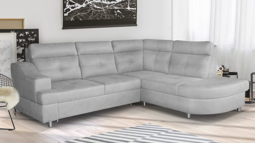 Narożnik rozkładany Novelus Premium w nowoczesnym salonie z funkcją spania i pojemnikiem na pościel