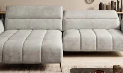 Stylowa sofa tapicerowana Cavani w nowoczesnym salonie z jasnymi ścianami i drewnianą podłogą