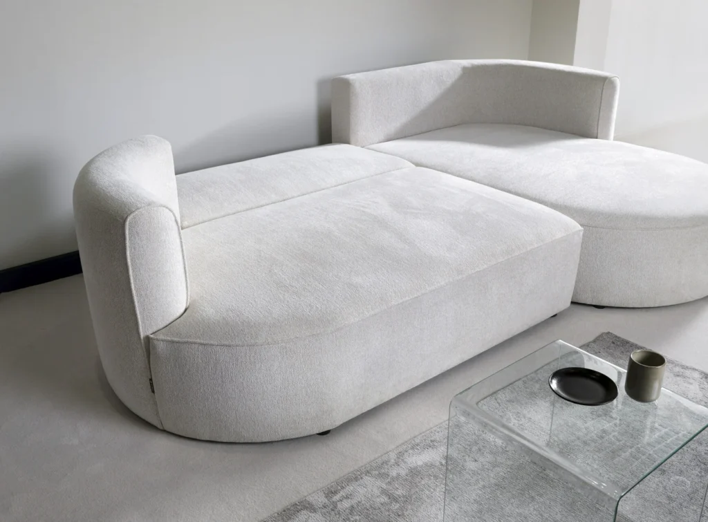 Narożnik rozkładany Fiore w tkaninie Modesto-492 z funkcją spania i pojemnikiem na pościel