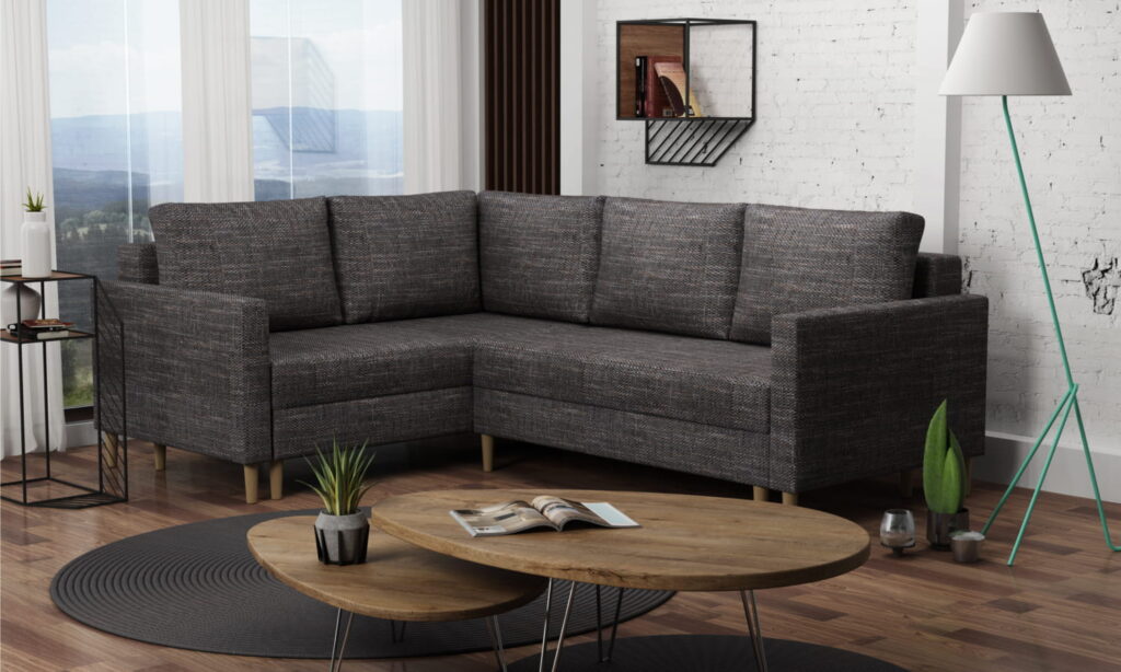 Narożnik rozkładany Gomez H1 w nowoczesnym salonie z jasnoszarą tapicerką i drewnianymi nogami