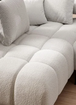 Nowoczesna tapicerowana sofa Magnetic L2 w szarym kolorze na jasnym tle