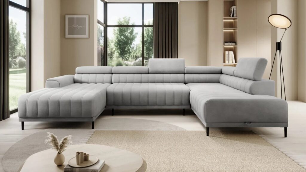 Narożnik rozkładany Caldo XL w jasnoszarym kolorze z regulowanymi zagłówkami i pojemnikiem na pościel