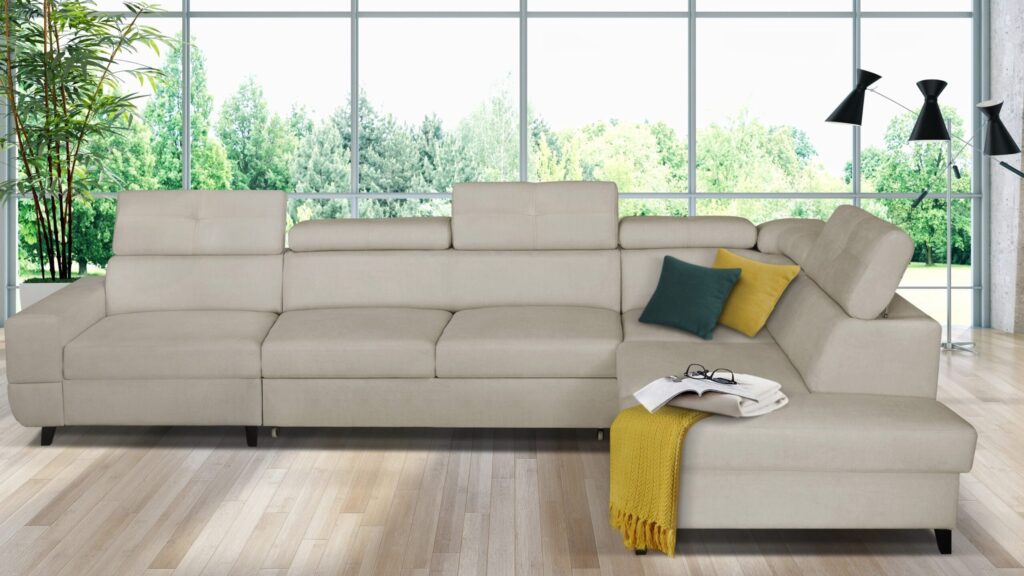 Narożnik rozkładany Cobra Premium+1 w nowoczesnym salonie z regulowanymi zagłówkami i pojemnikiem na pościel