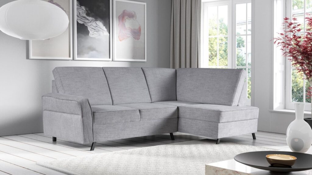 Narożnik rozkładany Euphoria w nowoczesnym salonie z czarnymi nóżkami i pojemnikiem na pościel
