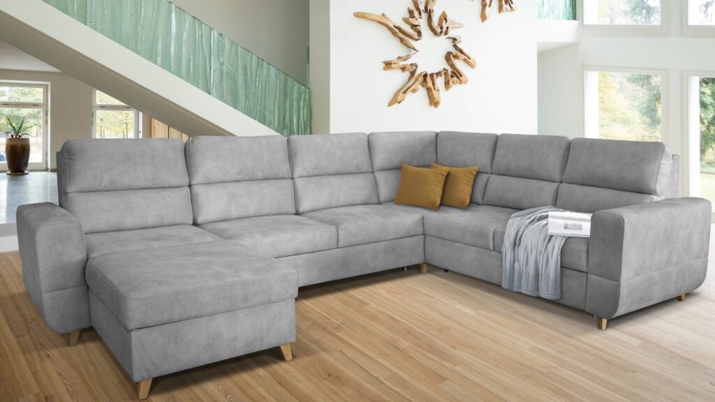 Narożnik rozkładany Maximus Maxi XXL w nowoczesnym salonie z funkcją spania i pojemnikiem na pościel