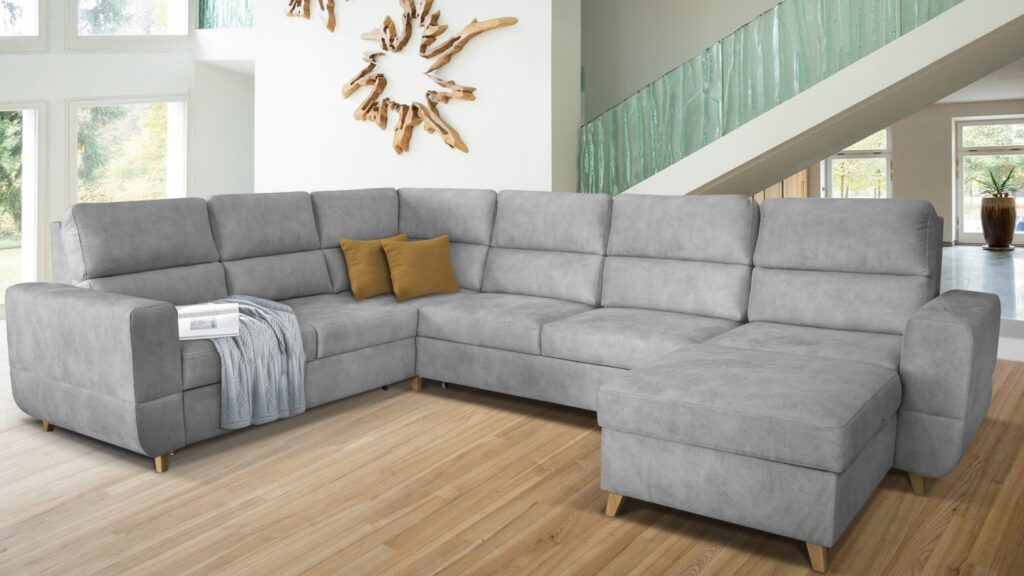 Narożnik rozkładany Maximus Maxi XXL w nowoczesnym salonie z funkcją spania i pojemnikiem na pościel