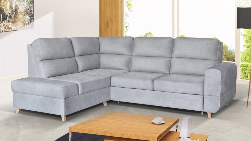 Narożnik rozkładany Maximus Premium w nowoczesnym salonie z funkcją spania i pojemnikiem na pościel