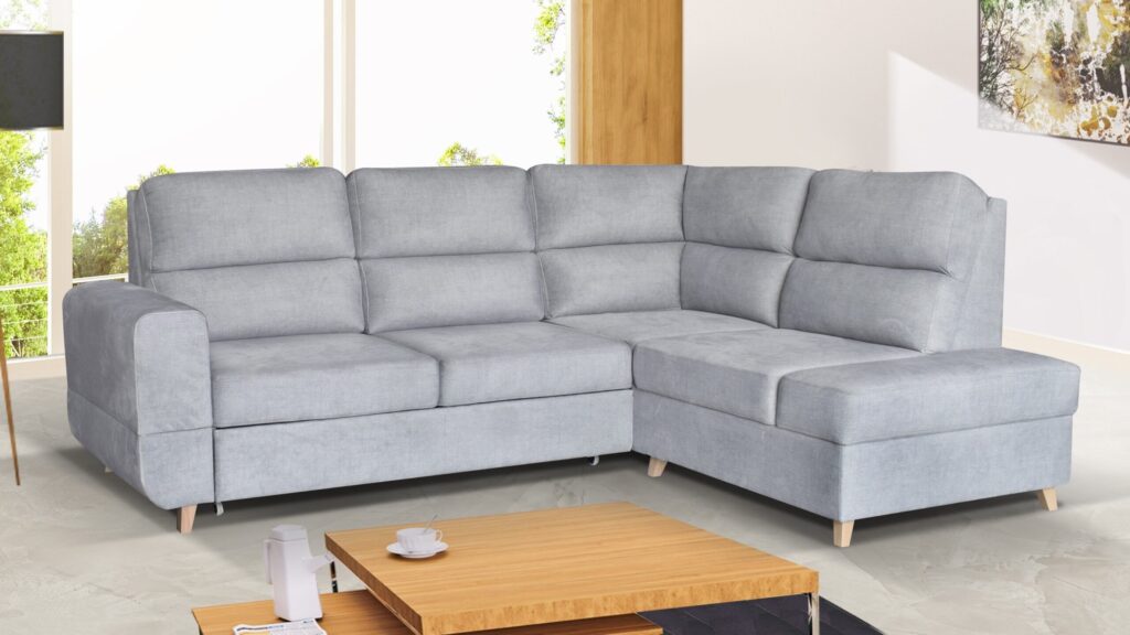 Narożnik rozkładany Maximus Premium w nowoczesnym salonie z funkcją spania i pojemnikiem na pościel