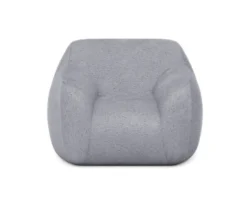 Fotel Teddy mini w tkaninie Lapid-06 w jasnym kolorze na białym tle, wygodny mebel do pokoju dziecięcego