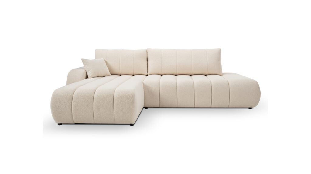 Narożnik rozkładany Baloo w jasnoszarej tkaninie z dekoracyjnymi przeszyciami na tle jasnego wnętrza