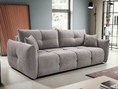 Kanapa rozkładana Base w nowoczesnym salonie z miękkimi poduszkami i pikowaną tapicerką