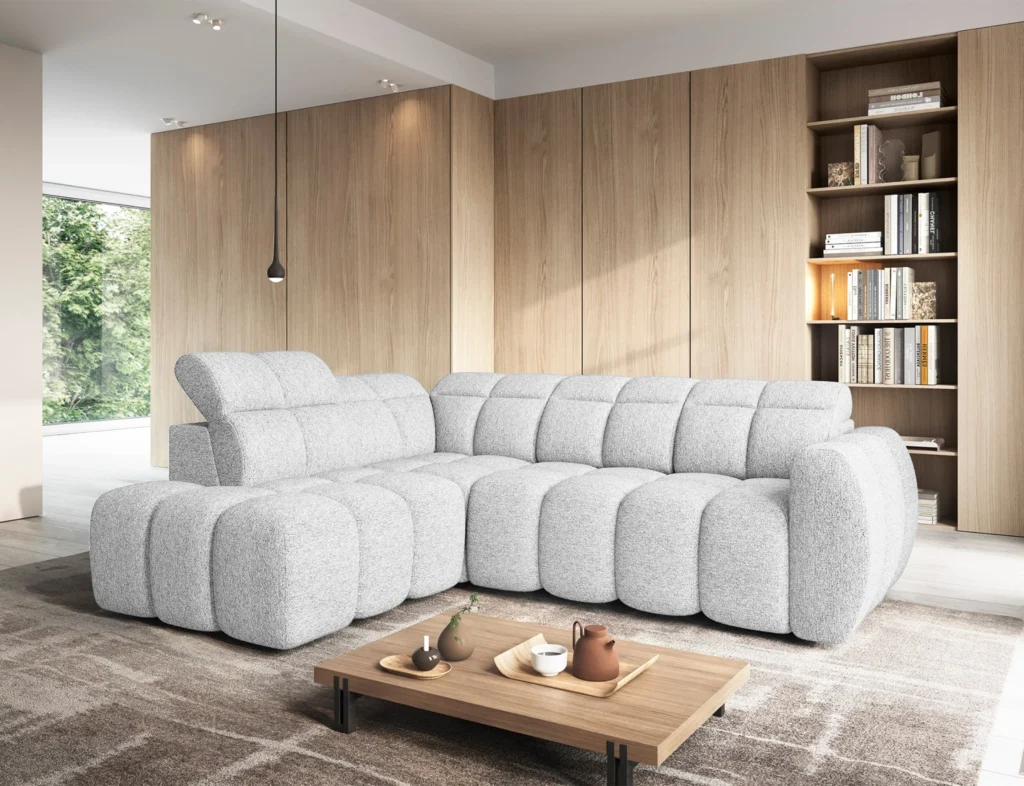 Biały narożnik elektryczny rozkładany Falconn w nowoczesnym salonie