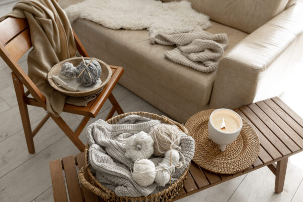 Threads for knitting in the interior of the room, a cozy composition with yarn, Scandinavian style.